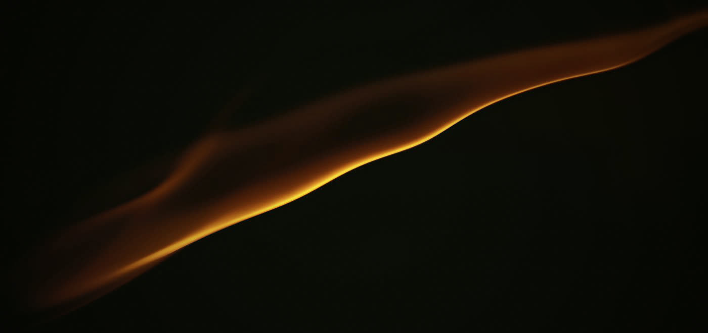 Abstract amber light curve on a dark field