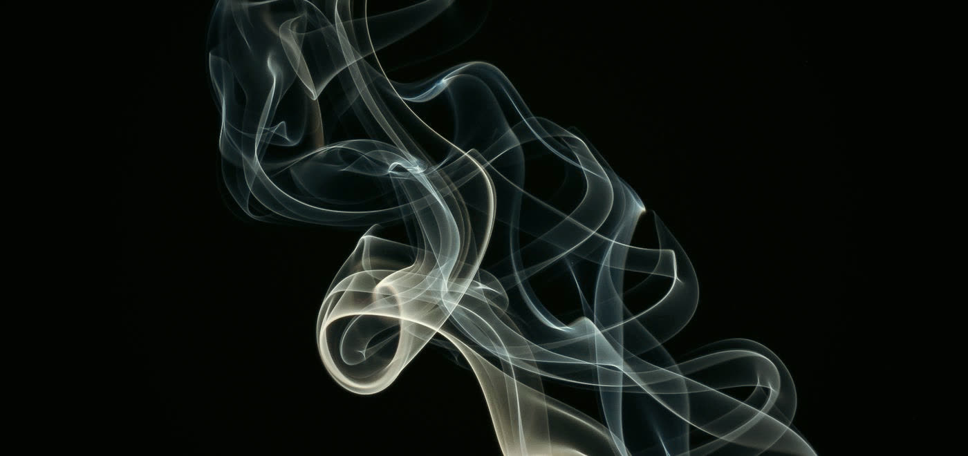 Abstract smoke wisps against black