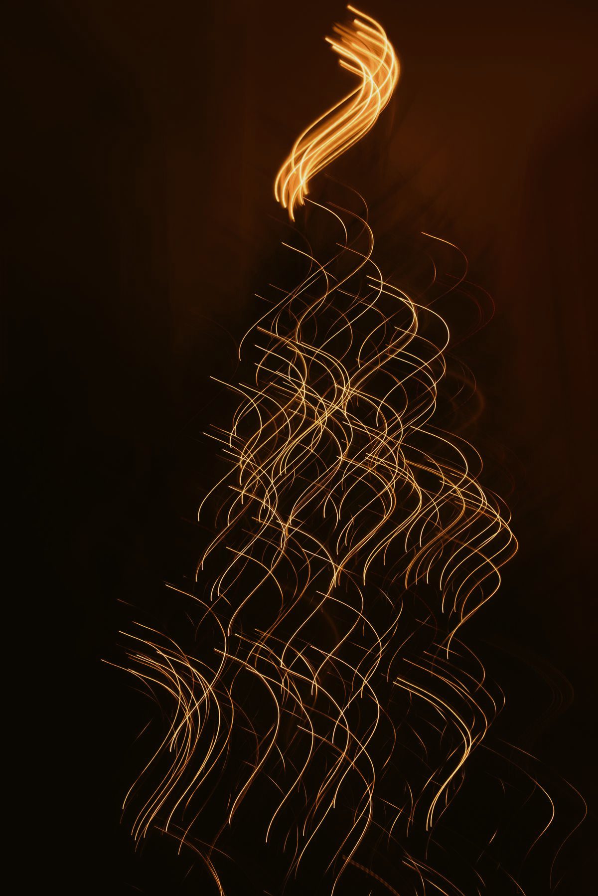 Abstract golden light trail in the dark