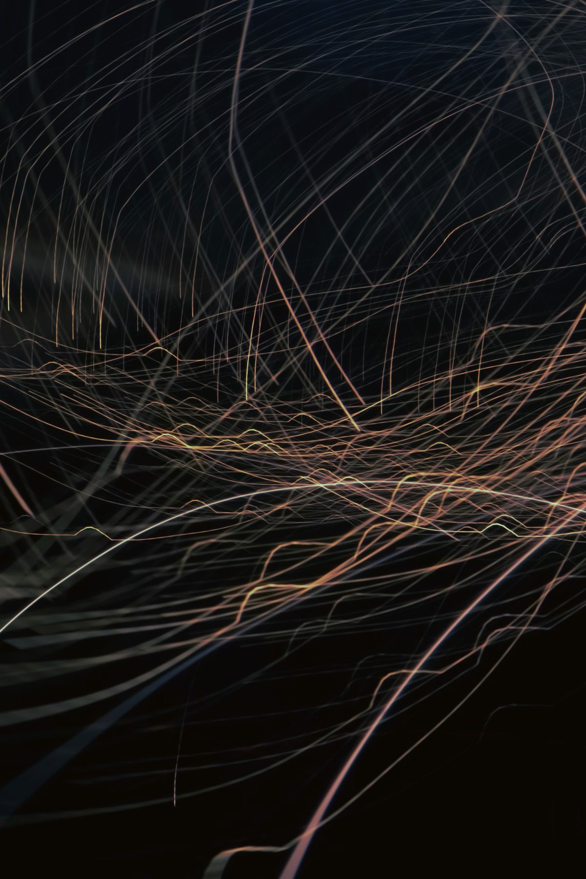Abstract amber light filaments on black